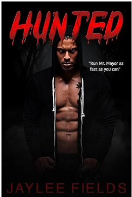 Dark, intense book cover features a muscular man in a hooded jacket, with "Hunted" in dripping red letters. Quote reads, "Run Mr. Mayor as fast as you can."