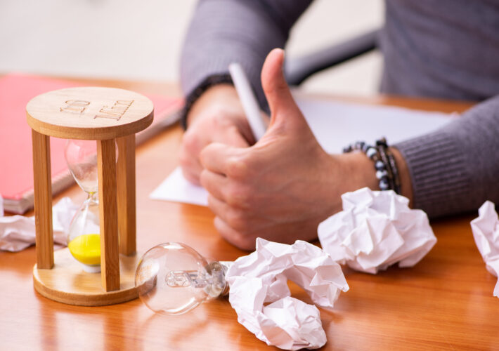 Male writer in time management concept